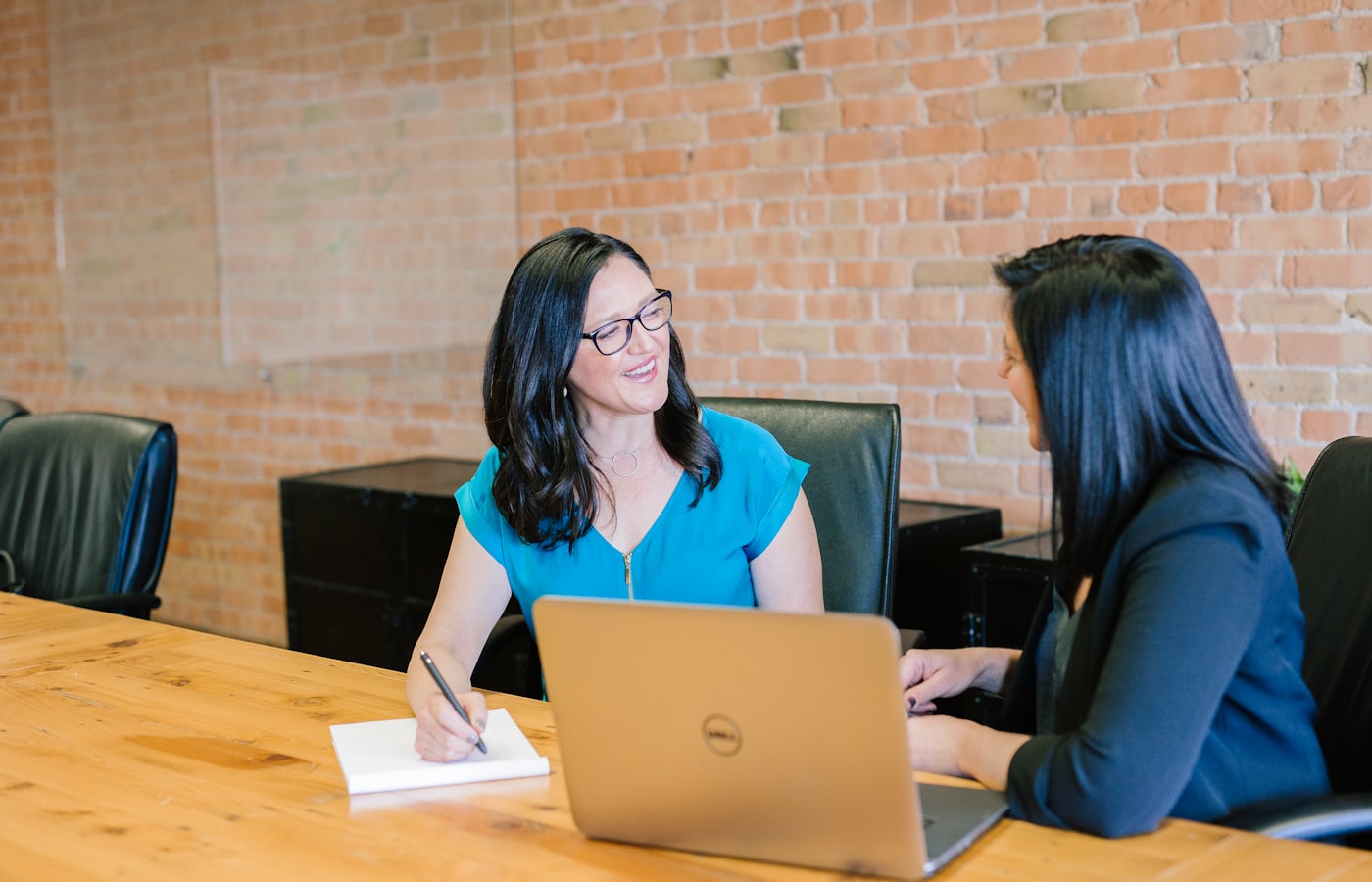 A solicitor meeting with clients about their will